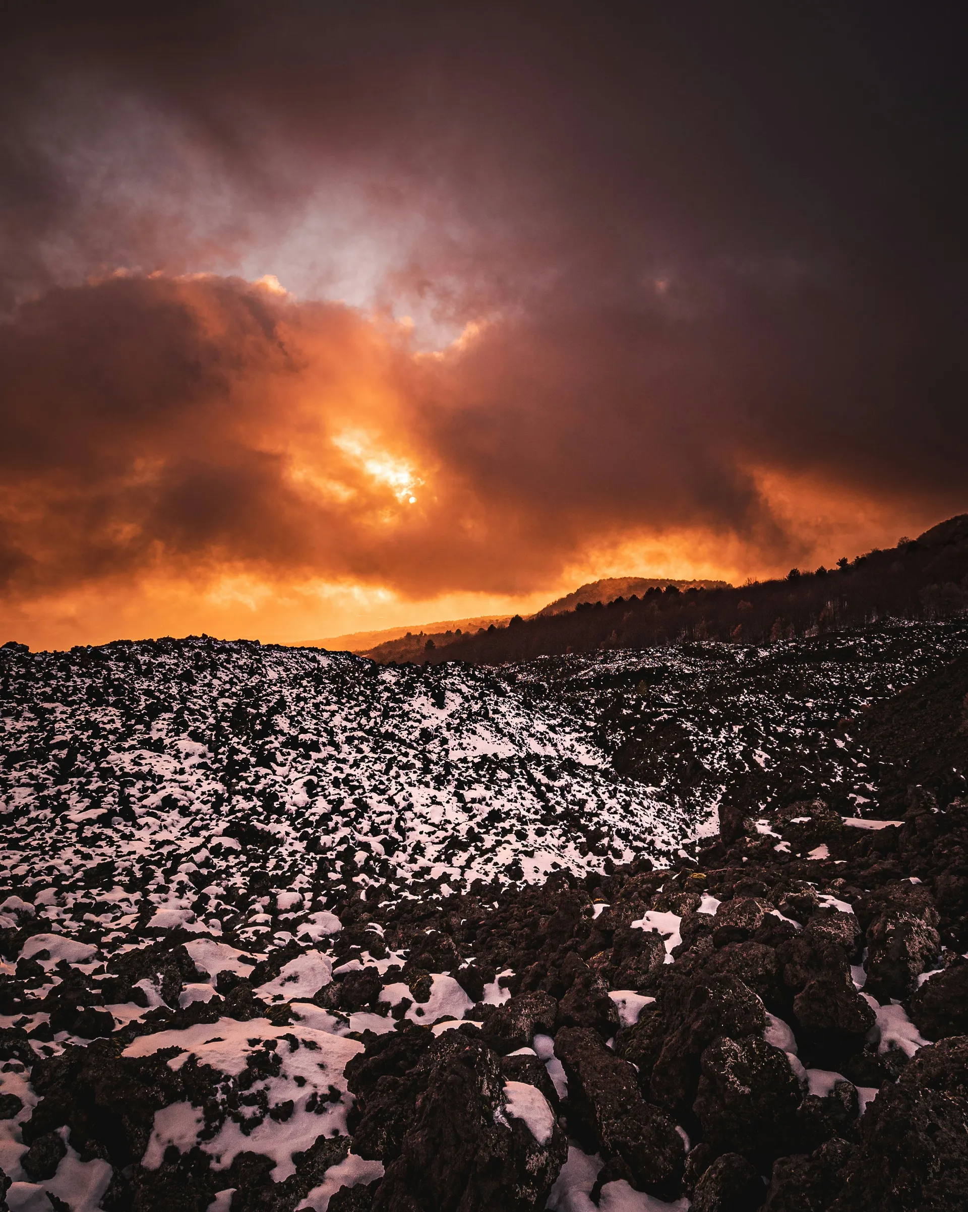 Sun setting over Etna's craters